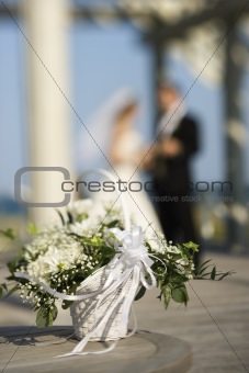 Flower basket with bride and groom.