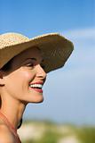 Woman in bikini and straw hat.