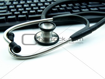 Stethoscope next to computer