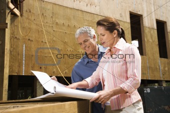 Man and woman on construction site.