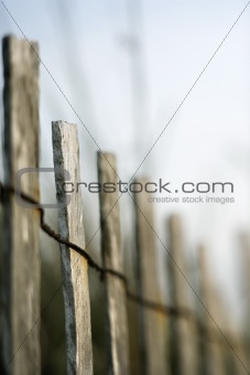 Wooden fence with wiring.
