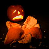Jack-o'-lantern with smashed pumpkin.