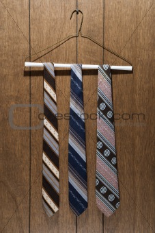 Three retro ties on hanger.