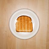 Slice of toast on plate.