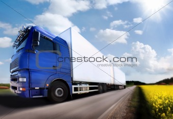 truck driving on country-road/motion