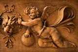 wood carving of cherub angel in the Vatican Museum, Rome, Italy.