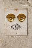 Ringer and speaker that look like a face in Venice, Italy.