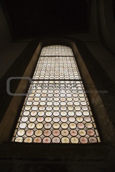 Low angle view of stained glass window.