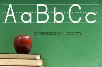 School books and chalkboard