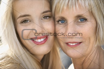 Mom and daughter smiling.