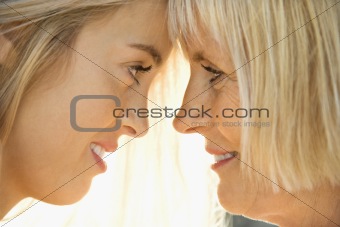 Mom and daughter looking at each other.