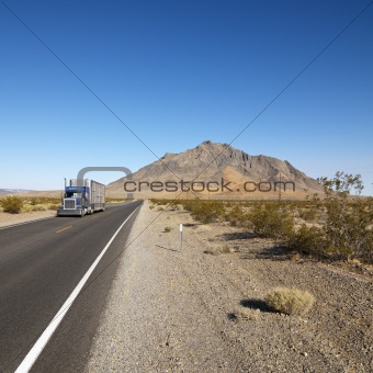 Truck on desert road.