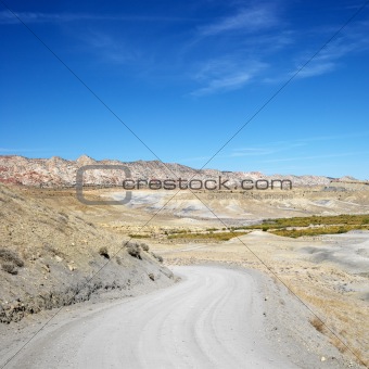 Gravel road in desert land of Cottonwood Canyon, Utah.