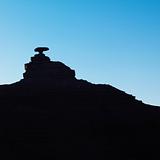Silhouette of Mexican Hat rock formation in Utah.