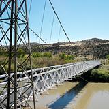 Suspension bridge over river in Utah.