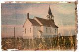 Polaroid transfer of rural church in field.