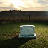 Headstone marking rural grave.