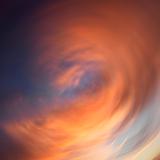 Spiral clouds in sky with sunset.