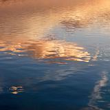 Reflections of sunset on water.