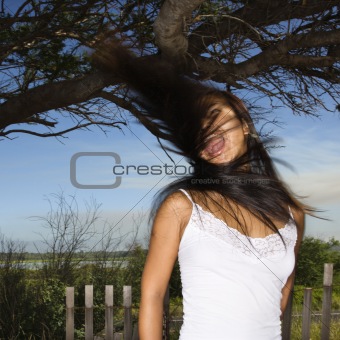 Woman screaming and swinging her hair.