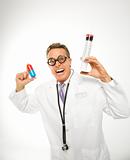 Doctor holding an oversized medical pill and syringe.