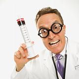 Doctor holding an oversized syringe.