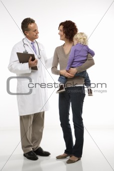 Doctor introducing himself to mother and daughter.