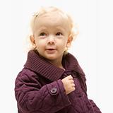 Female toddler wearing a purple coat.