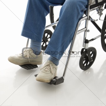 Legs in a wheelchair.