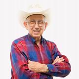 Portrait of elderly man in cowboy hat.