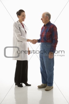 Doctor shaking hands with an elderly man.