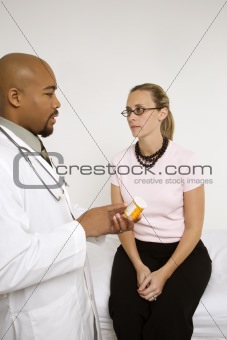 Doctor explaining medication to patient.
