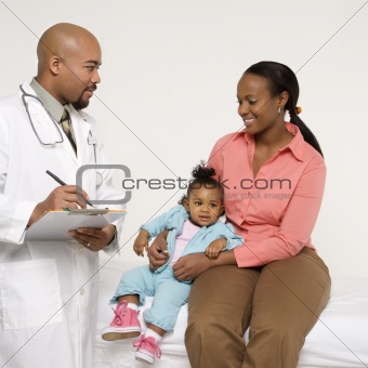 Mother and baby with pediatrician.
