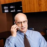 Caucasian businessman on cellphone.