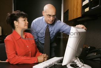 Businessman and businesswoman in office.