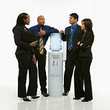 Business group standing around water cooler.