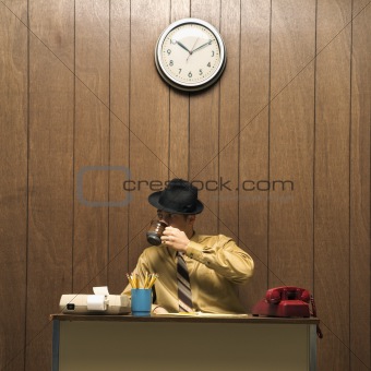 Retro business scene of man at desk.
