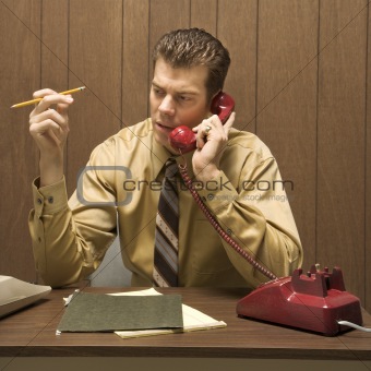 Retro business scene of man at desk.