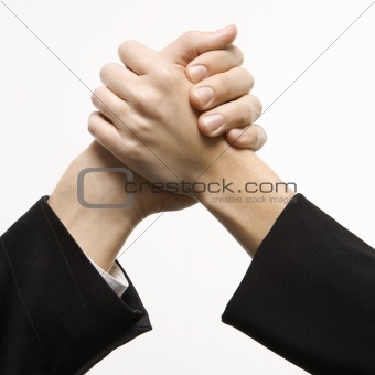 Man and woman grasping hands.