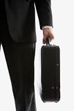 Businessman holding briefcase.
