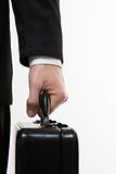 Businessman's hand holding briefcase.