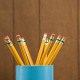 Close-up of a cup of wooden pencils.