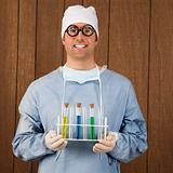 Male surgeon holding test tubes.