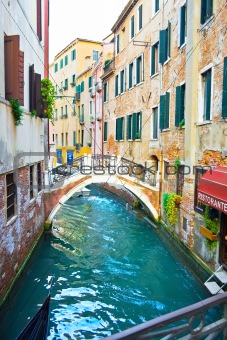 Canal in Venice and Restaurant