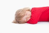 boy with long blond hair lying down sleeping - isolated on white