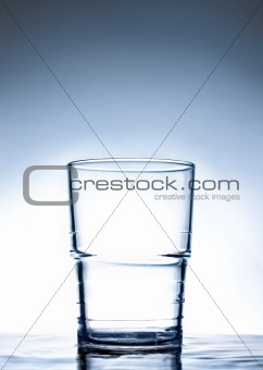 Simple glass standing on water.