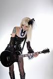 Sexy gothic girl playing guitar  