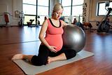 Pregnant woman doing relaxation exercise