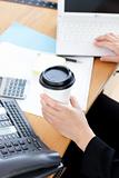 Close-up of a businesswoman drinking coffee 