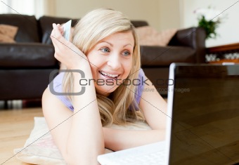 Radiant woman using a laptop
